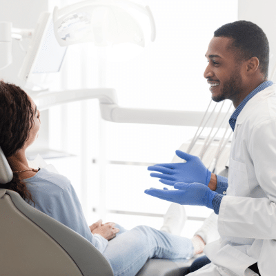 Dentist explaining post-treatment care to patient